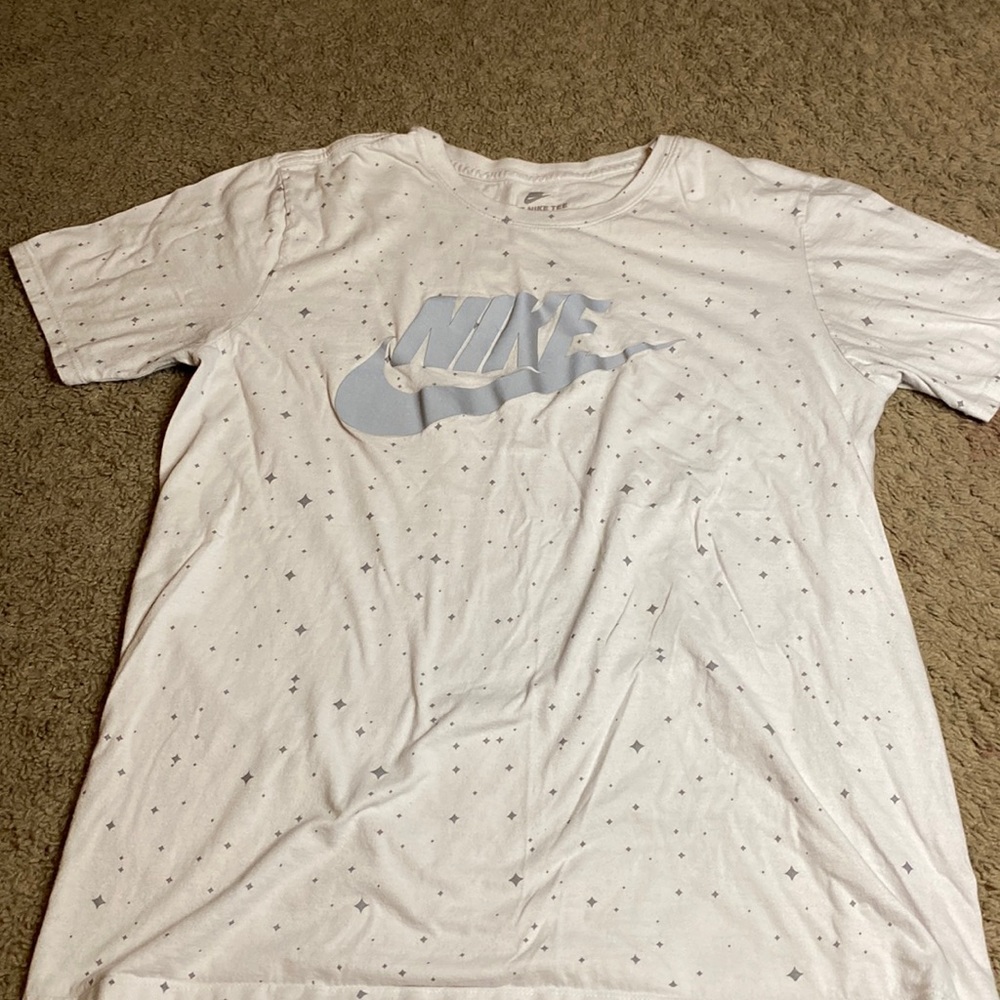 THE NIKE TEE Size large white with gray diamonds and Nike is reflective material